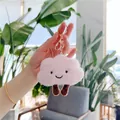 Close-up of pink plush cloud keychain with embroidered smile and golden metal clip - Gold Clasp / Pink