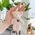 Close-up of beige teddy fleece bear keychain with dark heart embroidery and metal bead chain - Green Heart-Silver Chain / Off White / Approx. 12cm