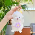 Detailed view of plush white lamb keychain with yellow knit hat and purple flower bag - Purple Flower Gold Clip / 15CM