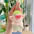 Close-up of a green angry pig plush keychain with cross-arms and a pink nose - Plain Chain / Green