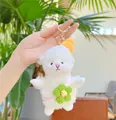 Detail of white plush lamb keychain with yellow knit hat and green flower bag - Green Flower Gold Clip / 15CM