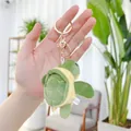 Close-up of a green plush turtle keychain with gold metal ring and lobster clasp - Gold Metal Buckle / 9cm