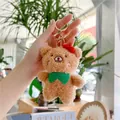 Close-up of a brown plush bear keychain with a red bow and golden metal clasp - Little Bear (Gold Buckle) / Brown / Approx. 12cm