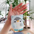 Close-up of cute plush penguin keychain wearing a light blue hooded sweatshirt in hand - Plain Chain / Blue / 10cm