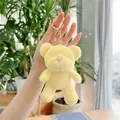 Detail of yellow plush teddy bear keychain with soft fur and golden metal lobster clasp - Gold Clasp / Yellow / 13cm