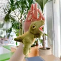 Detail of green plush dinosaur keychain with yellow fins and golden metal buckle - Gold Clasp / Dark Green / 16cm