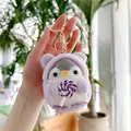 Close-up of penguin plush keychain wearing purple hoodie and holding a swirl lollipop - 10cm / Purple Lollipop (Gold Clasp)