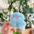 Close-up of light blue plush monster keychain with detailed embroidery and soft fur - With Hat (Regular Chain) / Blue