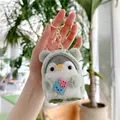 Detail of plush penguin keychain wearing a green frog hoodie holding a blue ice cream - 10cm / Green Ice Cream (Gold Clasp)