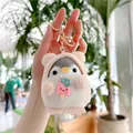 Close-up of plush penguin keychain in pink hood with gold metal ring and ice cream charm - 10cm / Pink Ice Cream (Gold Clasp)