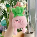 Close-up of a cute pink cabbage plush keychain with soft legs and green leaves - Gold Clasp / Pink