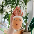 Close-up of a plush bubble tea keychain with cute smiling face and golden metal ring - Pearl Milk Tea - Gold Clasp