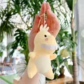 Dettaglio del portachiavi di dinosauro in peluche giallo con chiusura in metallo dorato - Giallo / Chiusura Dorata