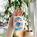 Penguin plush keychain in blue hoodie holding a striped lollipop with silver ring - 10cm / Blue Lollipop (Silver Chain)
