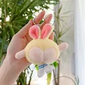 Close-up of funny yellow plush bunny keychain with blue striped socks and metal ring - Yellow Bead Chain