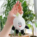Funny garlic plush keychain featuring a smiling white doll with golden metal lobster clasp - Big Mouth Garlic / Gold Clasp