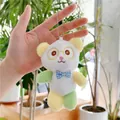 Close-up of cute panda plush keychain with colorful limbs and a blue checkered bow tie - Bead Chain Style / Yellow / 13cm