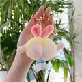 Detail of yellow plush bunny keychain with funny peach butt design and blue boots - Yellow With Gold Hook