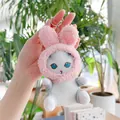 Close-up of plush white cat keychain wearing pink bunny ears with blue embroidered eyes - Plain Chain / Pink