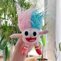 Close-up of funny plush doll with googly eyes and colorful messy hair accessory - Plain Chain / Pink + Blue