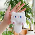 Witte pluche kat sleutelhanger met blauwe ogen en piepgeluid voor aan de tas - Gouden Sluiting / Wit