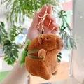 Detail of plush capybara keychain with green turtle shell backpack and gold hardware - Turtle Backpack Style (Gold Clasp)