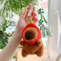 Close-up of plush Capybara keychain wearing a cute red strawberry hat with silver clip - Strawberry Hat Style (Gold Clasp)