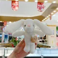 Detail of white plush bunny keychain with a brown mini bag accessory for bags - With Chain / White