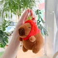 Detail of Capybara plush keychain wearing a red strawberry hat with a silver metal chain - Strawberry Hat Style (Silver Chain)