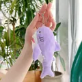 Detail of a purple plush shark keychain with white belly and silver metal ring - Hanging Chain / Purple
