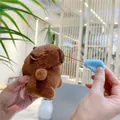 Detail of Capybara plush keychain showing a funny blue stretchable snot bubble accessory - Pulling Nose Style (Silver Chain)