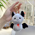 Close-up of cute grey plush bat keychain with red heart embroidery and golden clip - Gray (Gold Clasp)