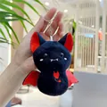 Detail of plush bat keychain with red embroidery and metal ring held by hand - Black (Regular Chain)