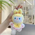 Close-up of white rabbit plush keychain with yellow hood and carrot embroidery detail - Yellow Bead Chain / 12cm