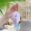 Detailed macro view of a colorful rainbow plush shark keychain held in hand for scale - Pink (Gold Clasp) / 13cm Length