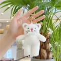 Close-up of a white plush cat keychain with golden metal clasp and pink nose detail - Gold Clasp / White