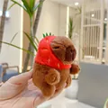 Close-up of a plush capybara wearing a red strawberry hat, held in hand for scale - Strawberry Hat Style (10cm) / Plain Chain