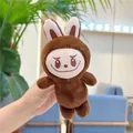 Detailed close-up of brown plush Labubu keychain with signature embroidery and sharp teeth - Style Without Chain / Coffee
