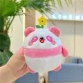 Close-up of pink panda plush keychain with yellow flower held in hand for scale - Rose Red (Chain)