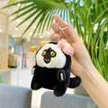 Cute white-faced monkey plush keychain featuring a pink flower and silver metal clasp - Hanging Chain / Pink