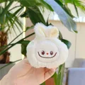 Close-up of white plush bunny pendant with soft fur and embroidered cute facial features - Squeaky Hanging Style / Beige