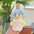 Close-up of a cute yellow plush duck keychain featuring a blue hat and white star vest - Blue Hat Style