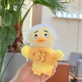 Close-up of yellow plush duck keychain with white lace headscarf and embroidery - White Hat Style