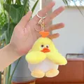 Cute duck plush keychain with heart detail and golden metal clip held in hand - Approx 9cm / Yellow (With Gold Buckle)