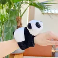 Close-up of a plush panda slap bracelet worn on a wrist with soft black and white fur - Slap Bracelet / Black and White Panda Style