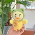 Close-up of plush duckling keychain wearing a green frog hoodie and biscuit detail - Green Hat Style