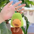 Detailed view of plush capybara avocado keychain with gold metal ring and lobster clasp - Avocado Style with Legs (12cm) / Gold Clasp