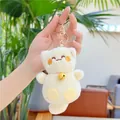 Dettaglio del portachiavi gatto in peluche crema con campanello dorato e gancio - Campanello Con Gancio Dorato / Beige