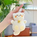 Dettaglio di ciondolo a forma di gatto in peluche con ricami e campanello giallo - Campanello Con Catena / Beige