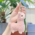 Cute pink alpaca plush keychain with curly fleece and gold clasp in hand-held display - Gold Clasp / Pink / Approx. 12cm
